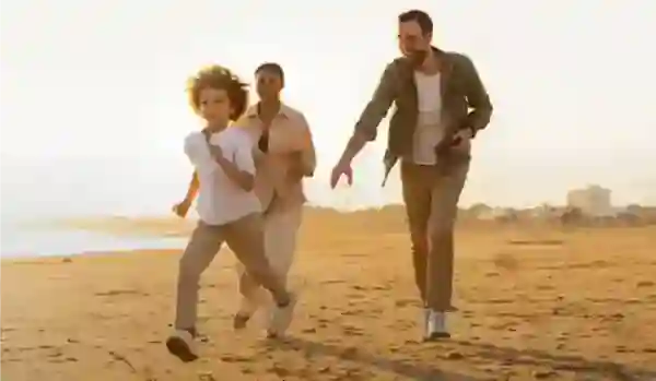Family running on the beach - Single fullwidth image