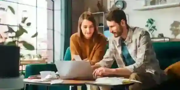 A man and a woman on a laptop researching important tax dates and deadlines in 2026.