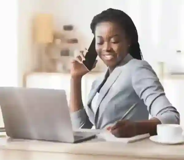 Let a tax expert do your taxes from start to file a lady Infront of her laptop smiling