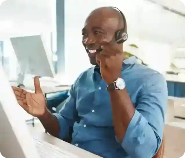 man consulting and speaking though headphones