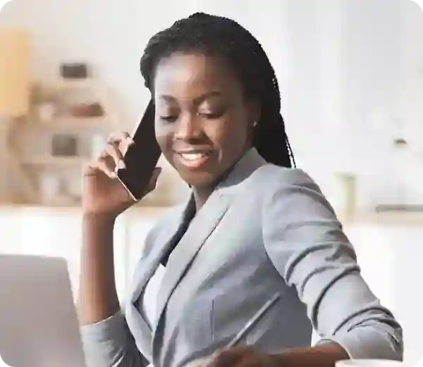 Let a tax expert do your taxes from start to file a lady Infront of her laptop smiling