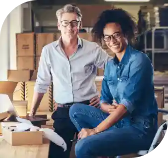 Trusted filing with guaranteed accuracy image two men smiling in warehouse